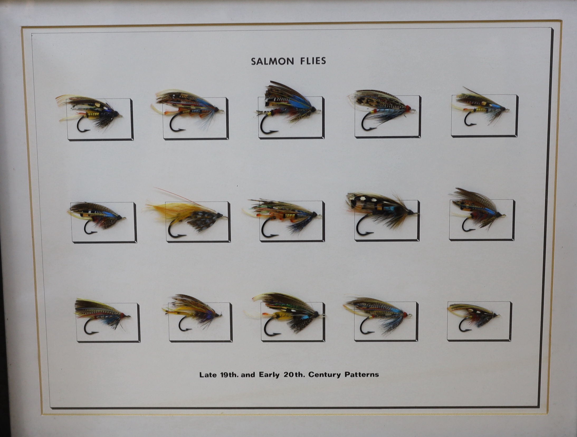 A collection of three framed and glazed fishing flies